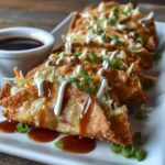 Crispy Applebee's-style chicken wonton tacos filled with Asian chicken, slaw, cilantro and sesame seeds on a wooden board