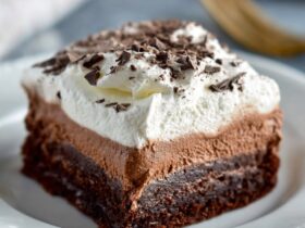 Chocolate French silk brownies with fudgy brownie base, light silky chocolate mousse middle, whipped cream top, and chocolate shavings