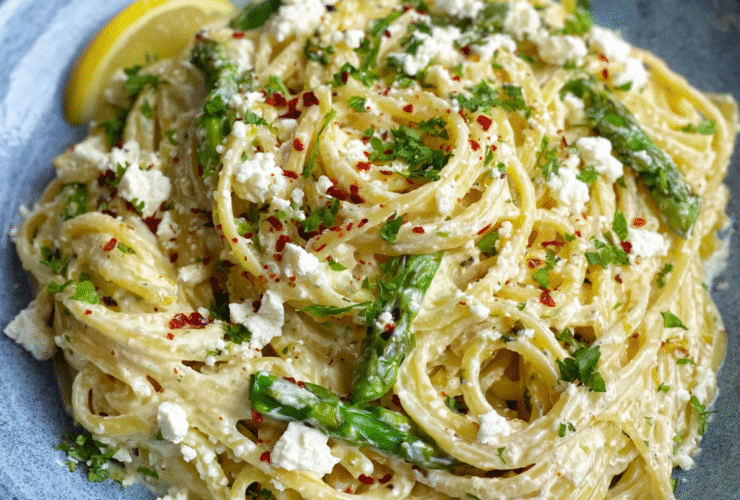 Creamy lemon feta pasta in a white bowl with rigatoni coated in lemony cream sauce, melted feta, fresh dill, lemon zest, cracked pepper